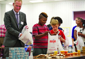 Donors, officials, volunteers participate in ‘Blessings in a Backpack’ program