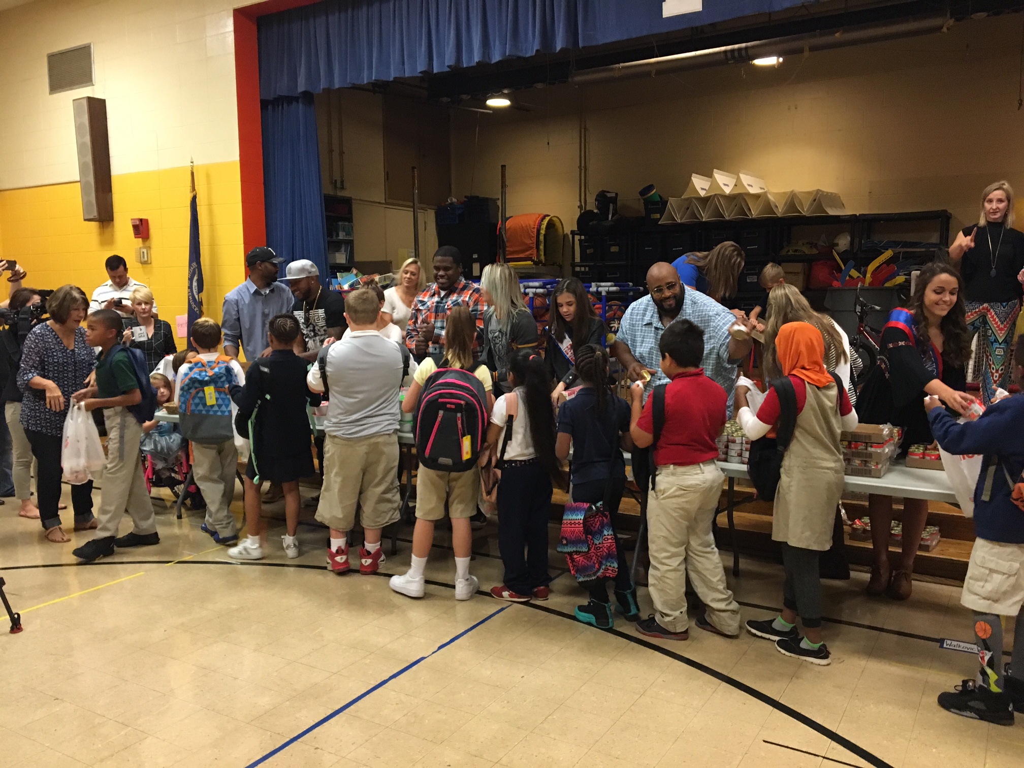 Linkin Bridge Packs Bags at Louisville Schools