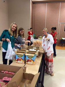 Junior League of Akron packs food for 435 children