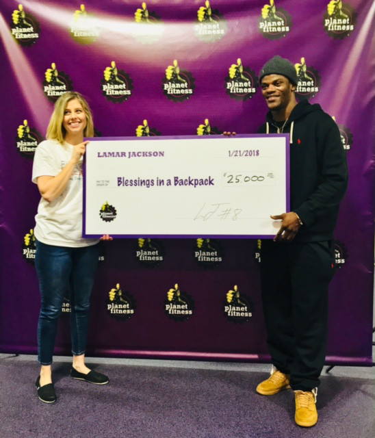 lamar jackson presents 25,000 check to blessings in a backpack