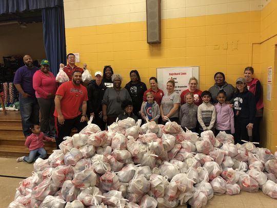 Engelhard teachers and staff pack 400 bags of food