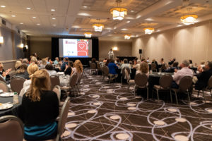 Attendees viewing a presentation