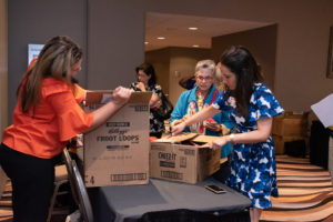 Volunteers Unpacking Food Cartons