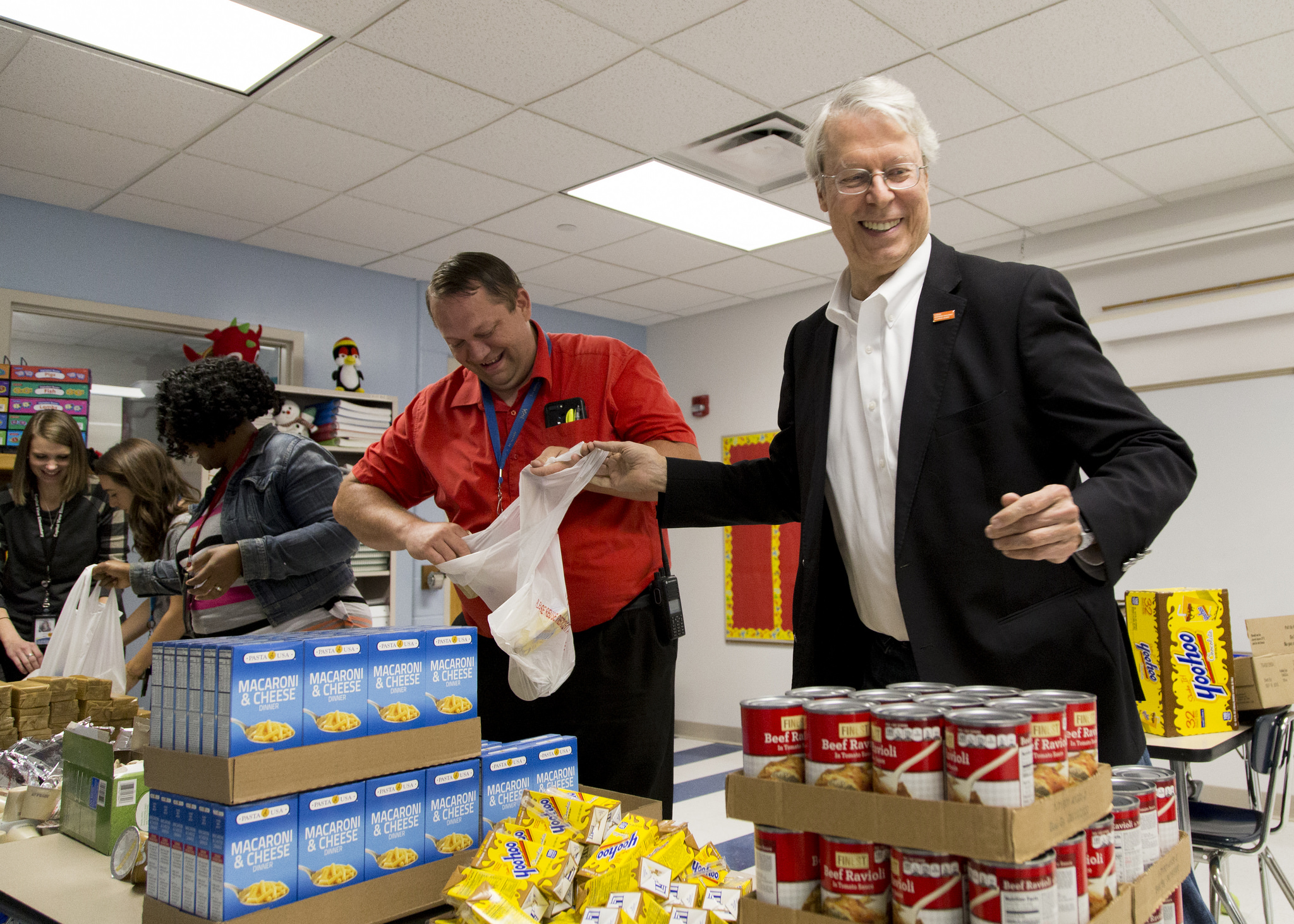 Mayors join local volunteers to pack backpacks full of food for children in-need on Blessings in a Backpack Day