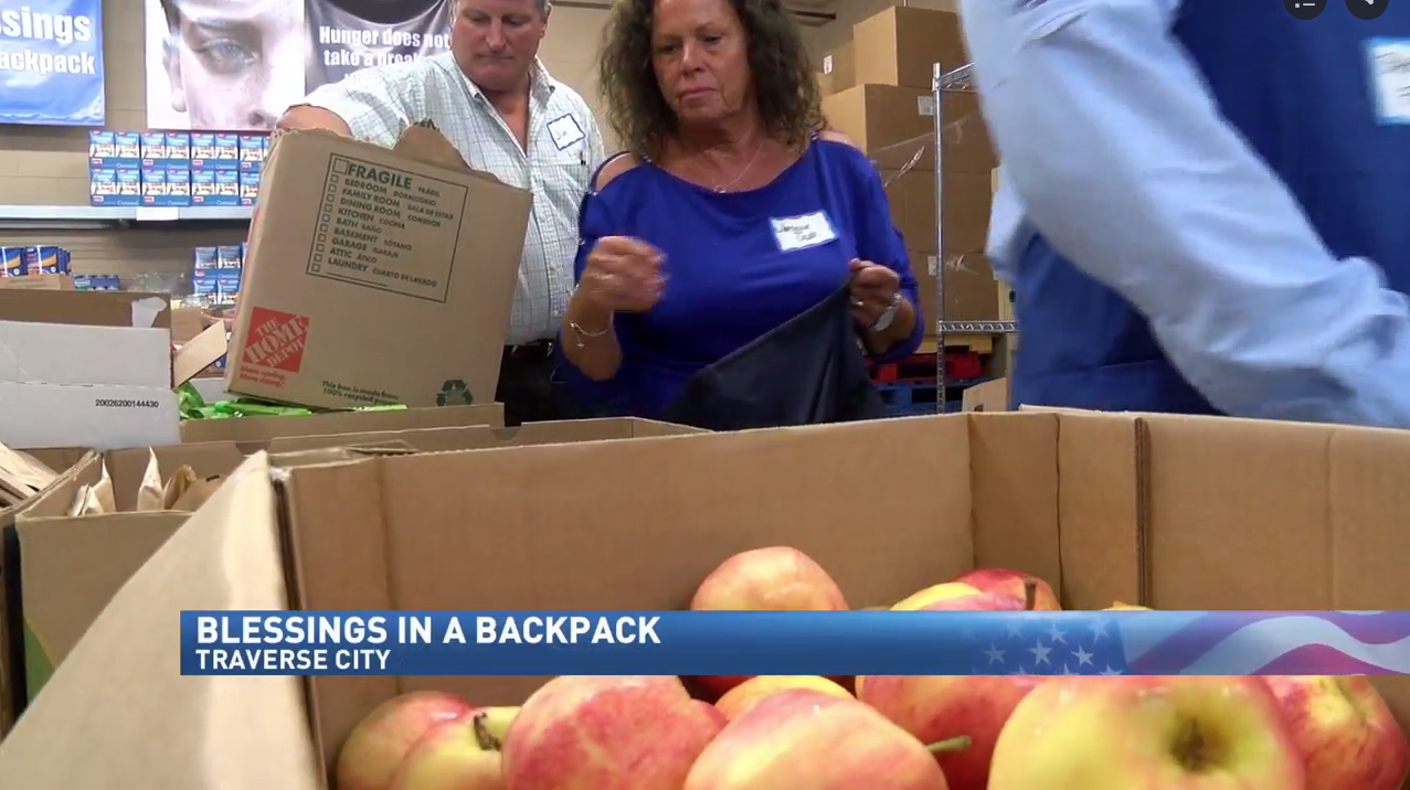 Father Fred kicks off Blessings in a Backpack for new school year