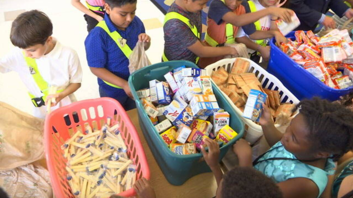 Students help Jacksonville mayor pack Blessings in a Backpack