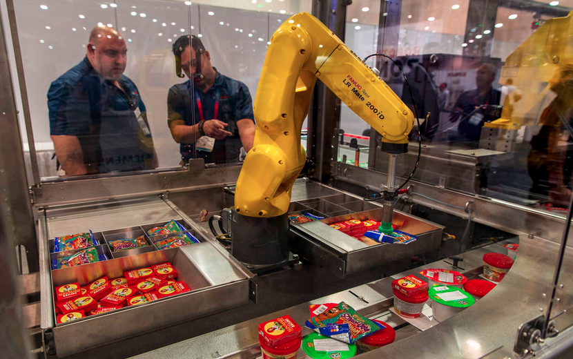 Robots at PACK EXPO Pack 6,000 Bags of Weekend Food