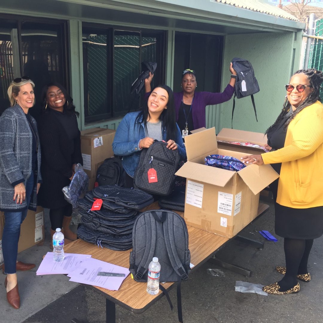 Related Affordable employees pack bags of food