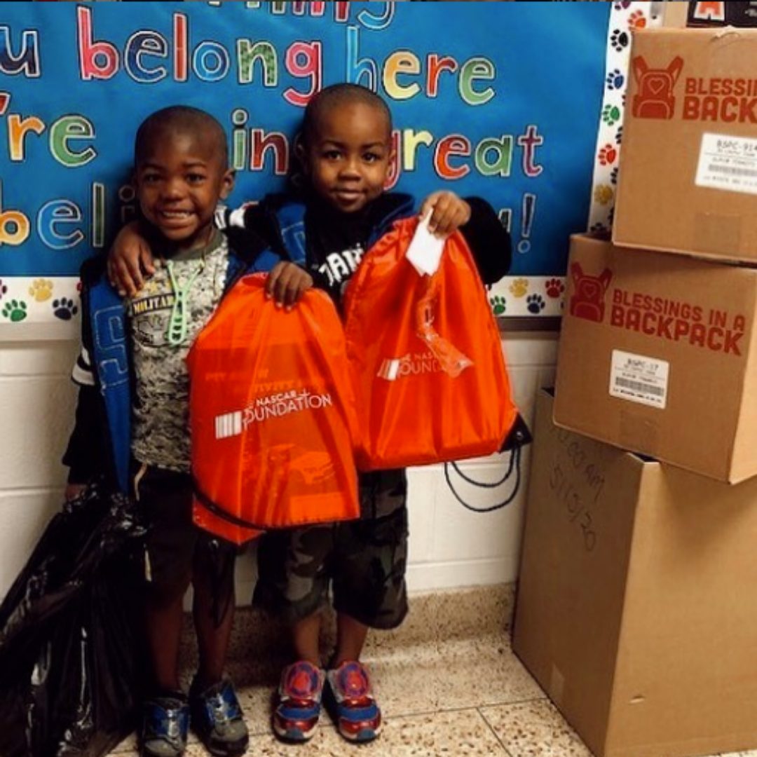 Kids holding bags of food