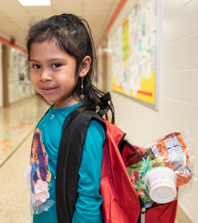 Child with Food in her Backpack
