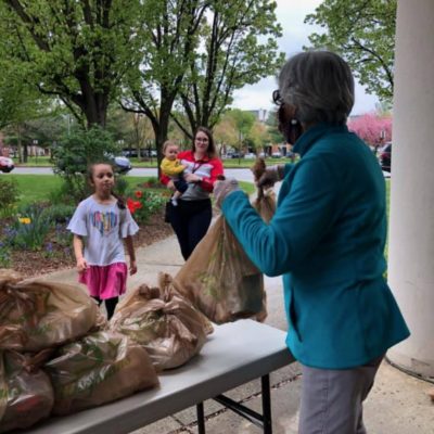 Frederick volunteer handing out food