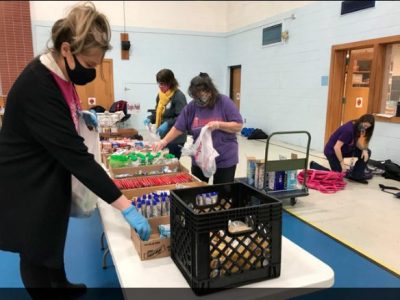 Volunteers Pack Bags for Deforest Kids