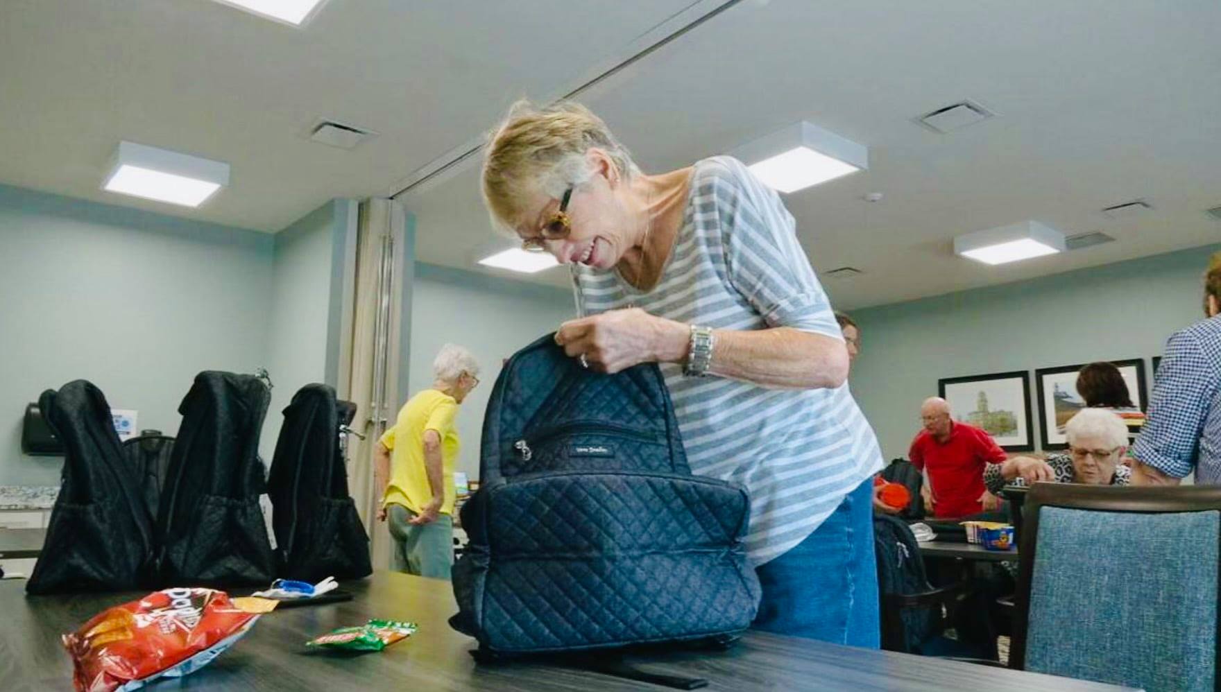 Seniors fill backpacks for children facing food insecurity