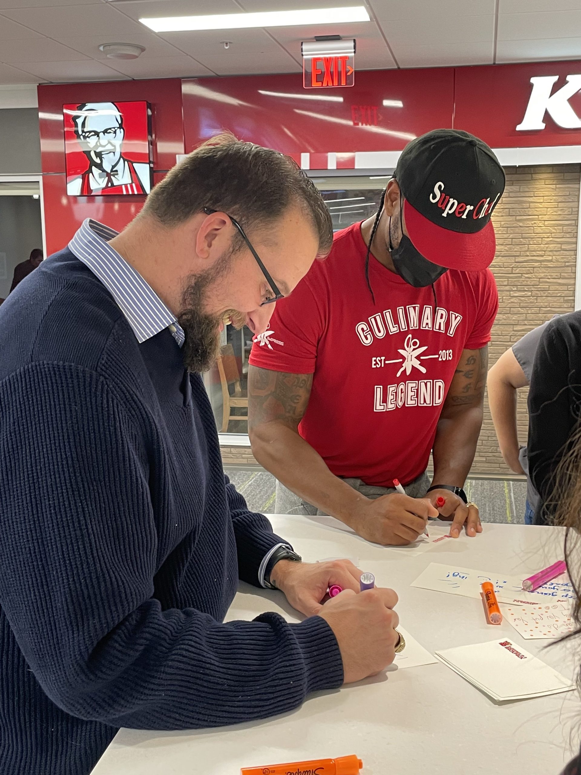 Darnell and Employees writing Notecards Darnell and Employees writing Notecards