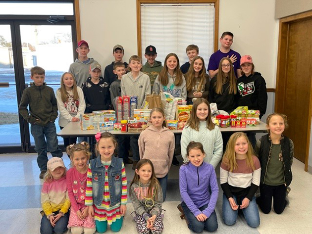 4-H members collect snack donations for Blessings in a Backpack