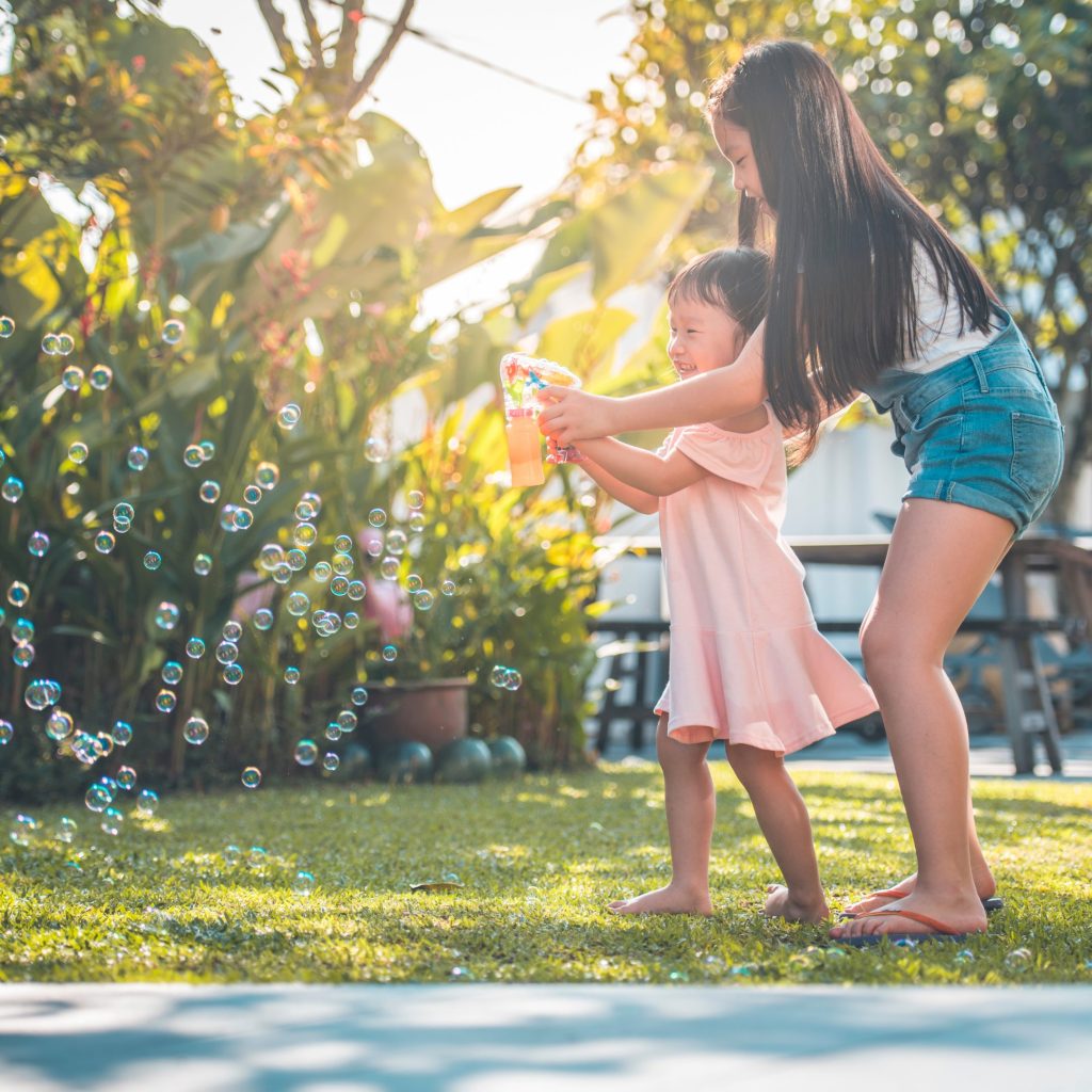 Girls playing with bubbles