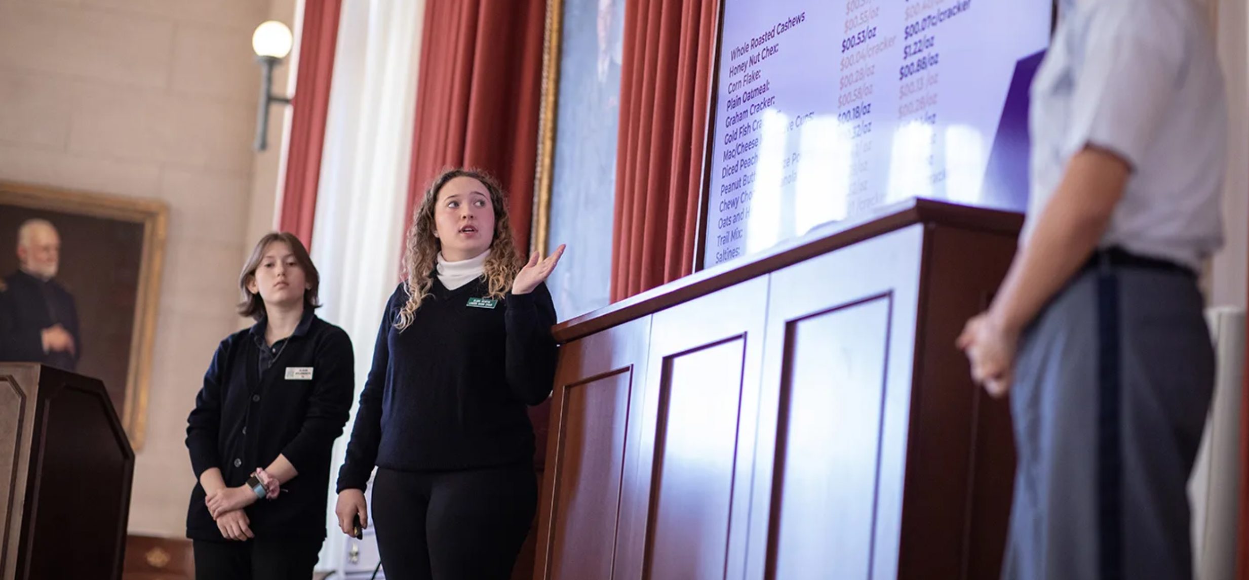 Eleni Kurtis '23 presents a proposal from the Ace team as Alison Aylesworth looks on.
