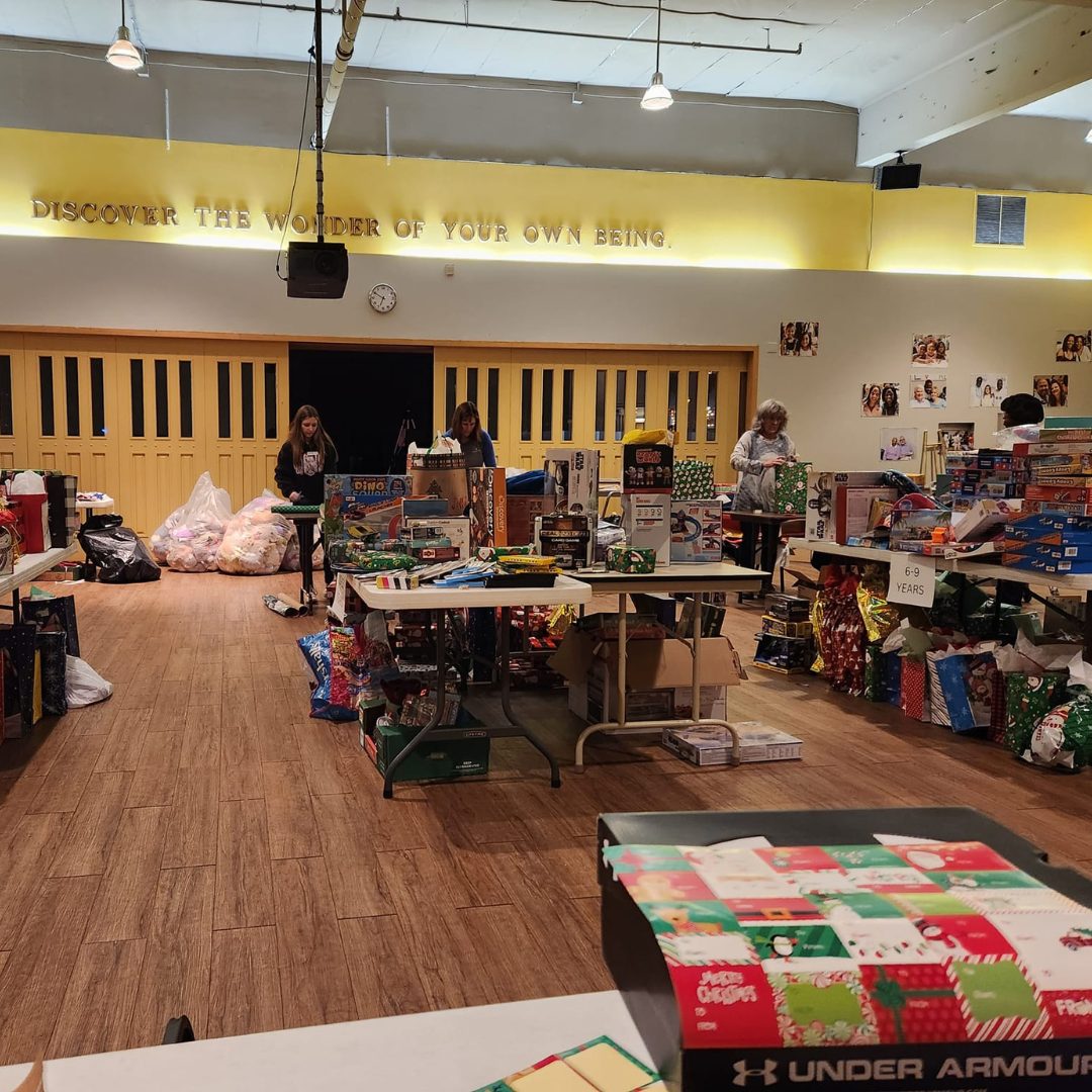 volunteers wrapping toys