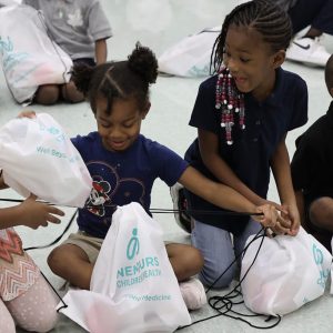 Children participating in Blessings in a Backpack (Photo Credit: William Estep/Nemours Children's Health System)