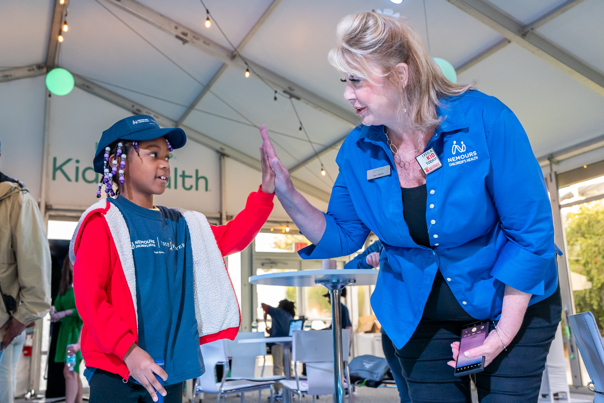 Nemours, Blessings in a Backpack, and Fuyrk volunteers pack food for kids