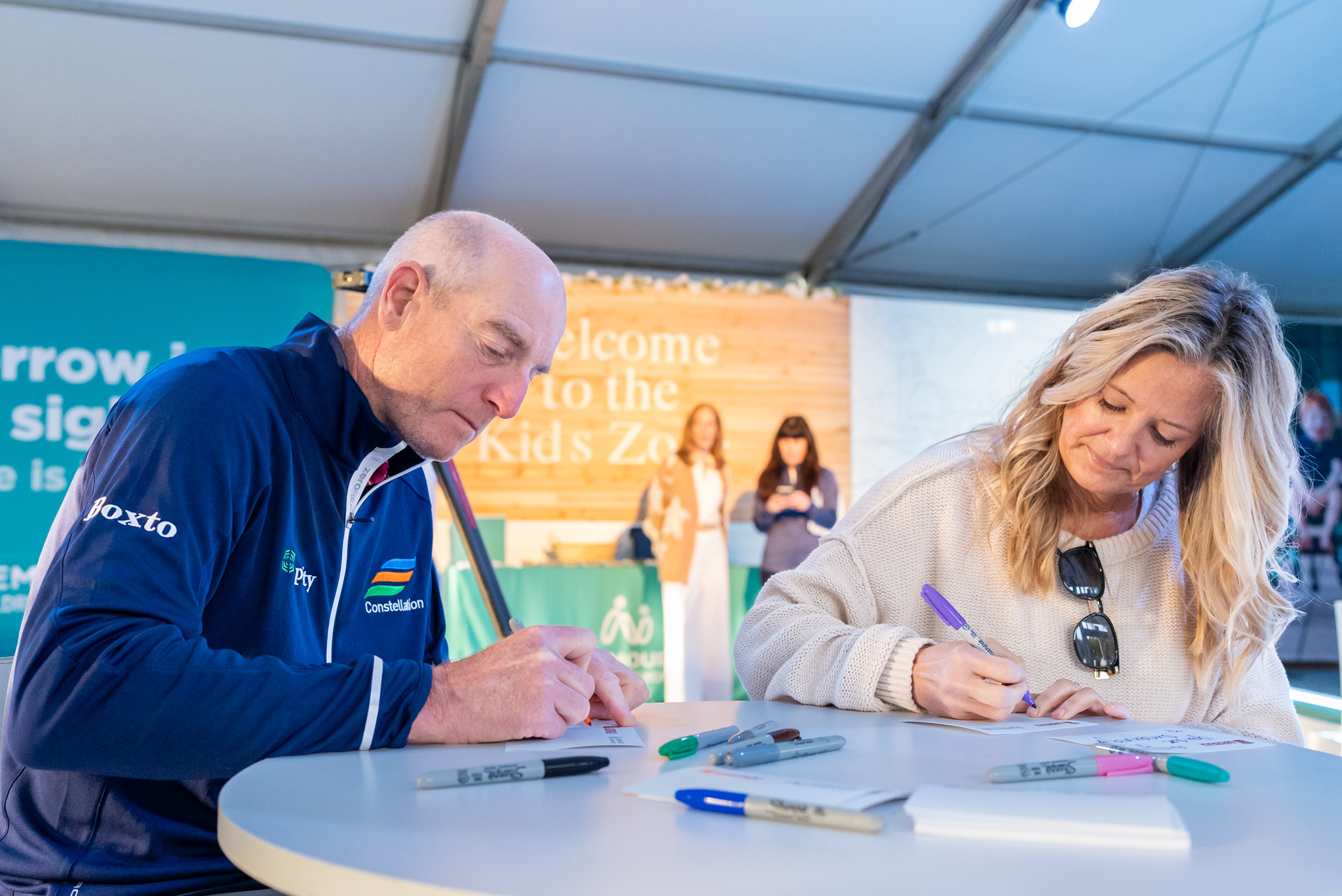 Jim and Tabitha Furyk writing note cards for kids